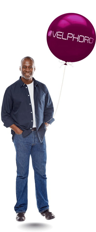 man holding Velphoro balloon